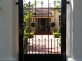 Elegant wrought iron personal access gate