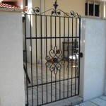 wrought iron courtyard gate with centre motif